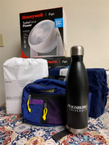 Water bottle, fan, bag, and sheets