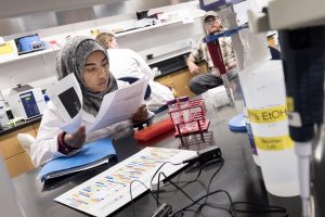 Students performing lab research.